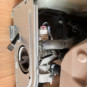 LG washer drain pump and filter during repair and maintenance in Ottawa